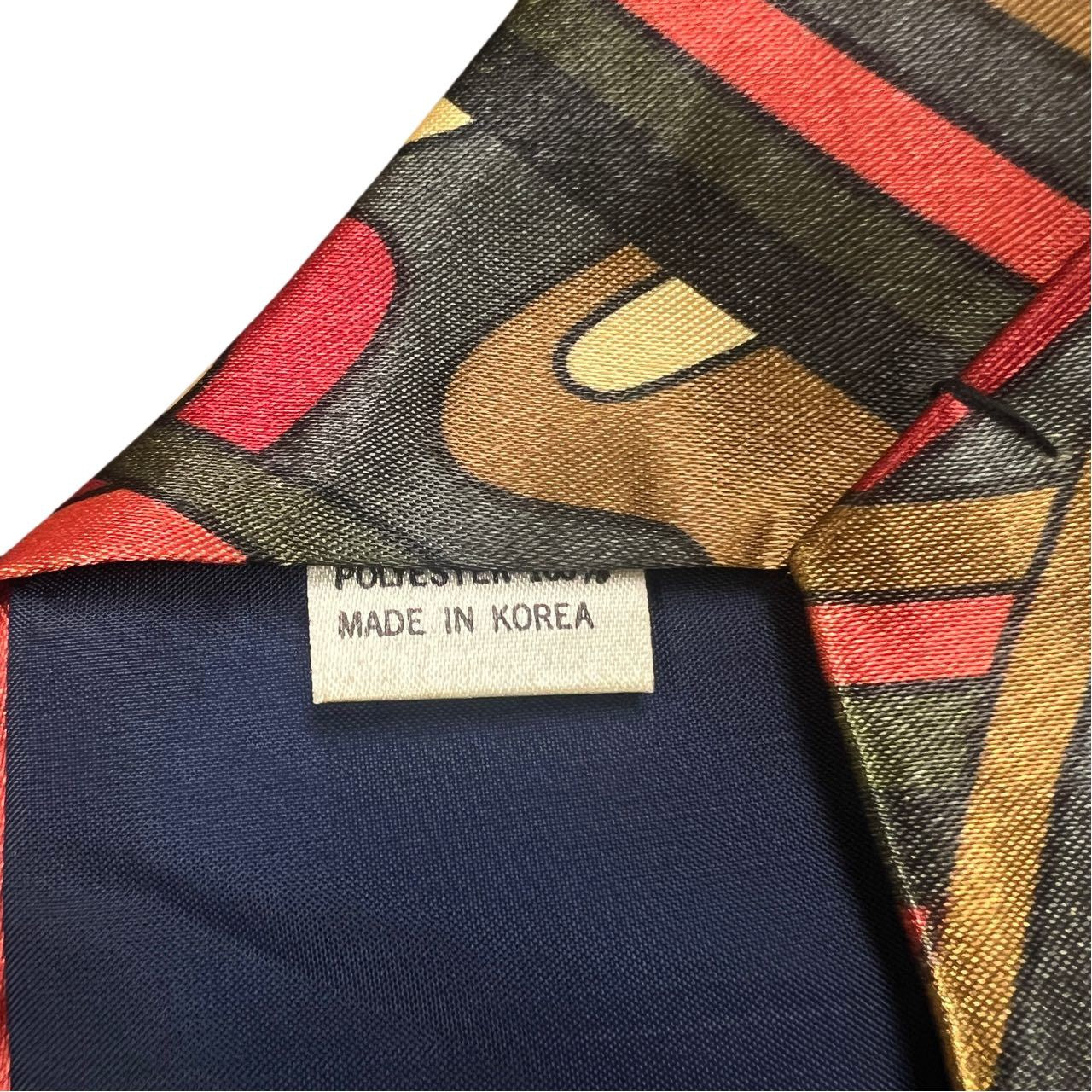 KING tie, red and brown-toned, with tag