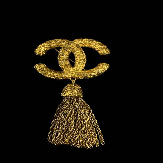 CHANEL brooch, gold-tone alloy hardware, tassel detail, logo design