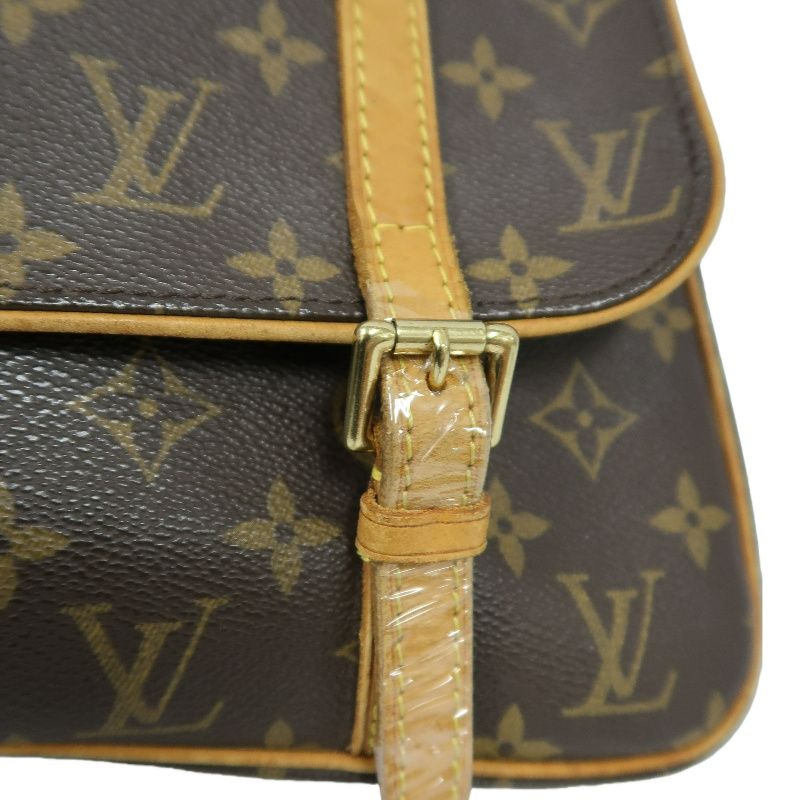 LOUIS VUITTON Marelle Sac a Dos Monogram Handbag, Brown. LV Monogram PVC Backpack.