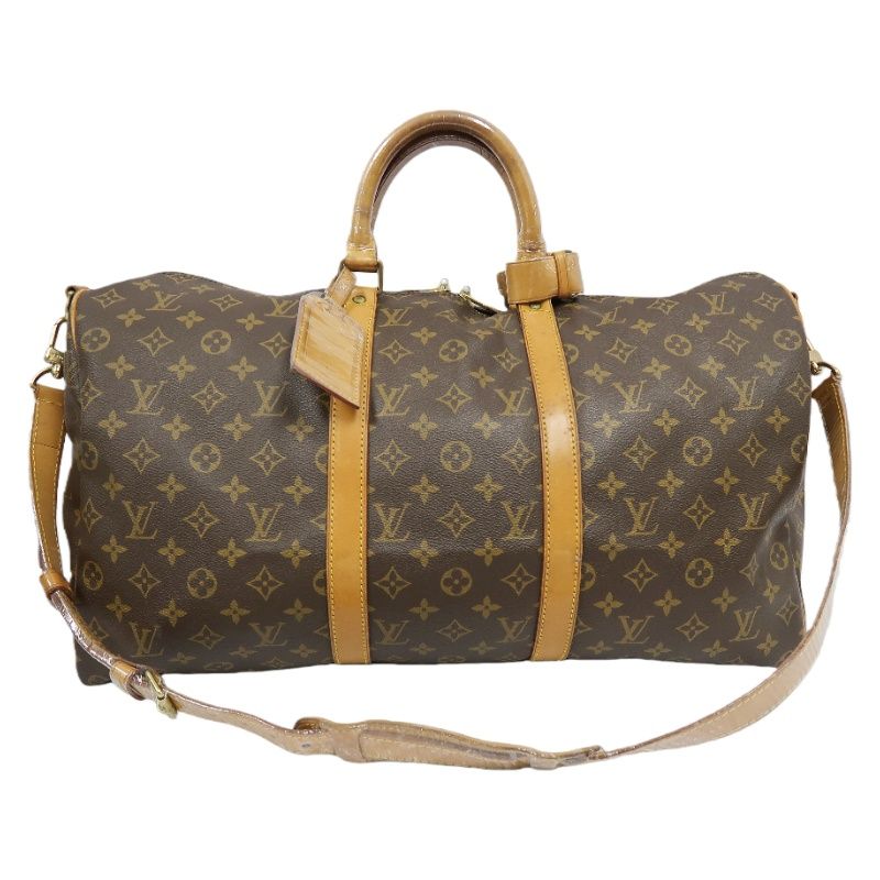LOUIS VUITTON Keepall Bandouliere 50 Monogram Boston Bag, Brown. Comes with shoulder strap, name tag and handle strap. LV Monogram PVC Keepall travel duffel bag, handbag.