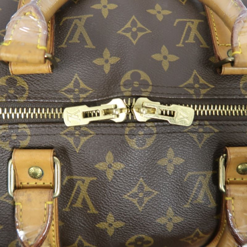 LOUIS VUITTON Keepall Bandouliere 50 Monogram Boston Bag, Brown. Comes with shoulder strap, name tag and handle strap. LV Monogram PVC Keepall travel duffel bag, handbag.