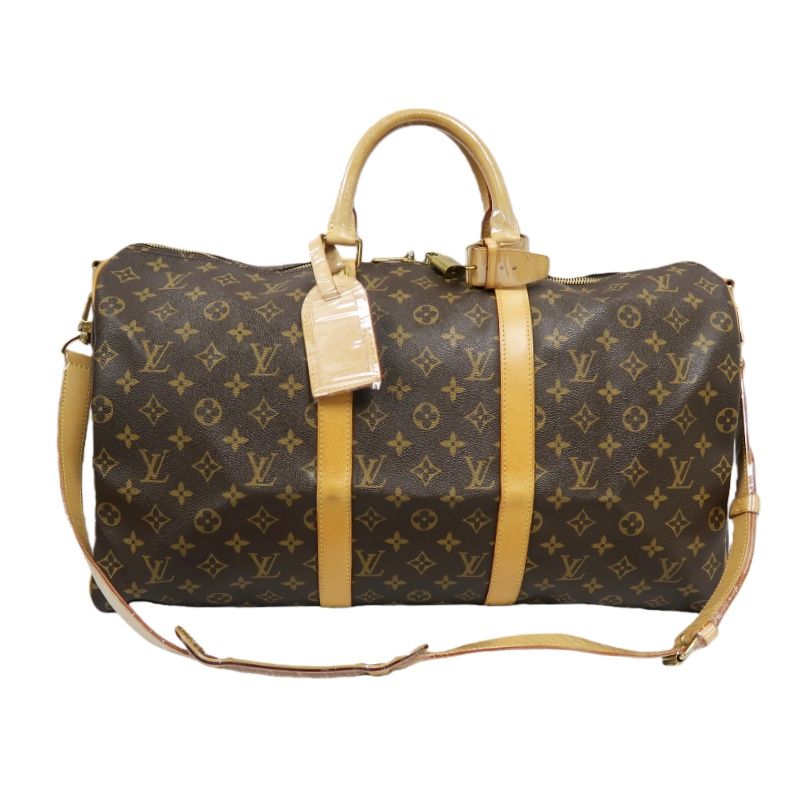 LOUIS VUITTON Keepall Bandouliere 50 Monogram Boston Bag, Brown. Includes padlock, shoulder strap, name tag and poignet. No keys. LV Monogram PVC Keepall 50 travel duffel bag, handbag.