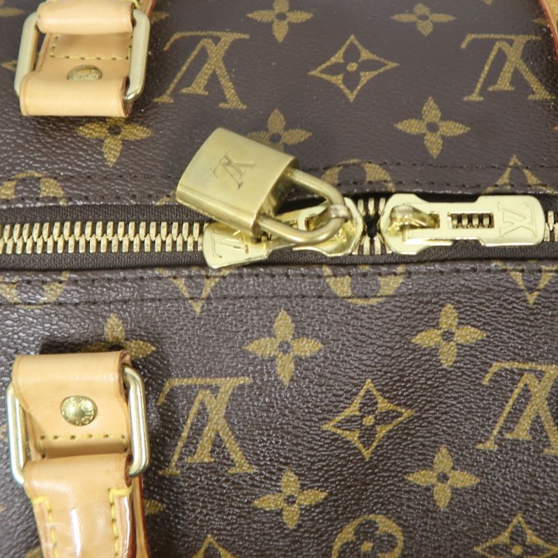 LOUIS VUITTON Keepall Bandouliere 50 Monogram Boston Bag, Brown. Includes padlock, shoulder strap, name tag and poignet. No keys. LV Monogram PVC Keepall 50 travel duffel bag, handbag.