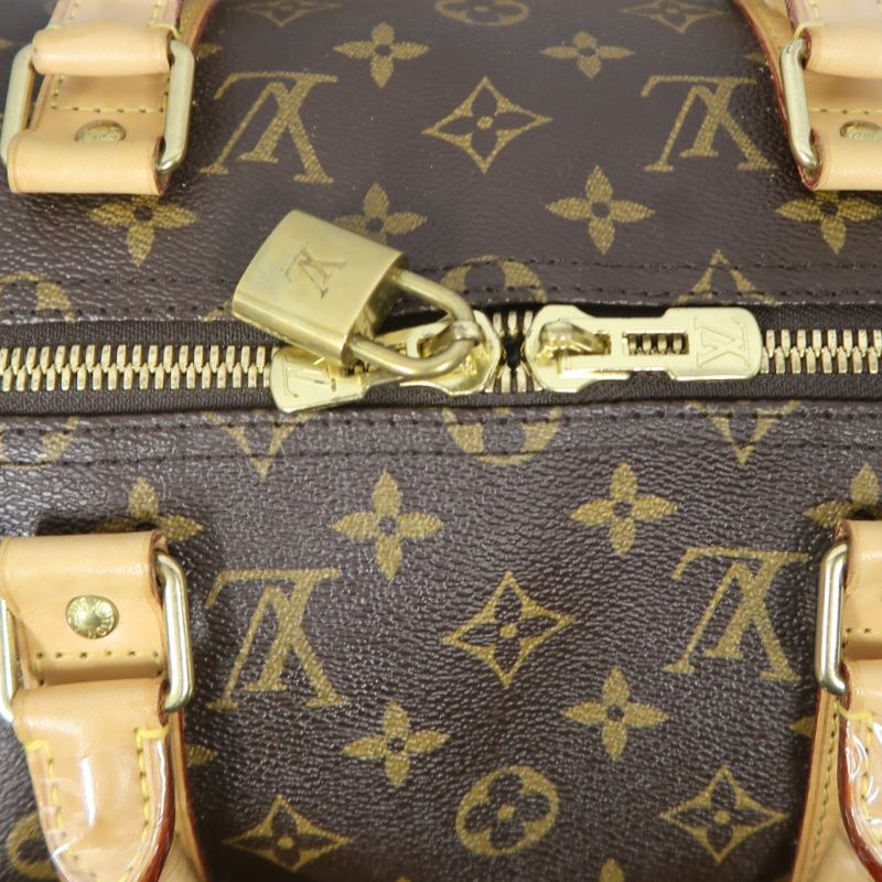 LOUIS VUITTON Keepall Bandouliere 50 Monogram Boston Bag, Brown. Includes padlock, shoulder strap, name tag and poignet. No keys. LV Monogram PVC Keepall 50 travel duffel bag, handbag.
