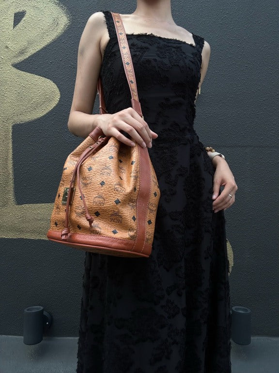 MCM Visetos Classic Monogram Camel Brown Drawstring Bucket Shoulder Crossbody Bag With Leather Trim, Gold Hardware