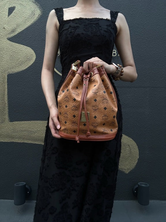 MCM Visetos Classic Monogram Camel Brown Drawstring Bucket Shoulder Crossbody Bag With Leather Trim, Gold Hardware