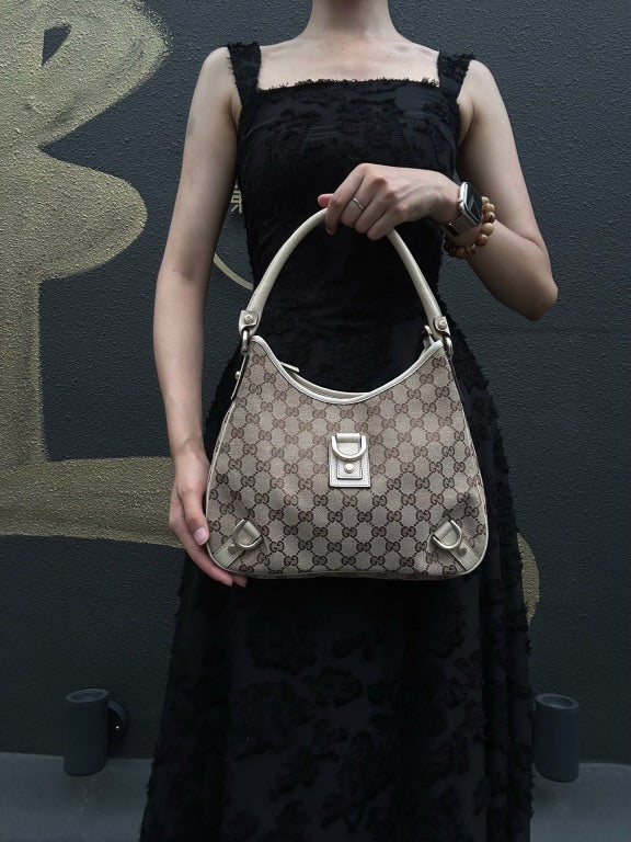 GUCCI GG Monogram Canvas Hobo Shoulder Bag Beige Brown Classic Pattern Light Tan Off White Leather Trim Gold Hardware Vintage Elegant Spacious Casual Daily Commute Bag
