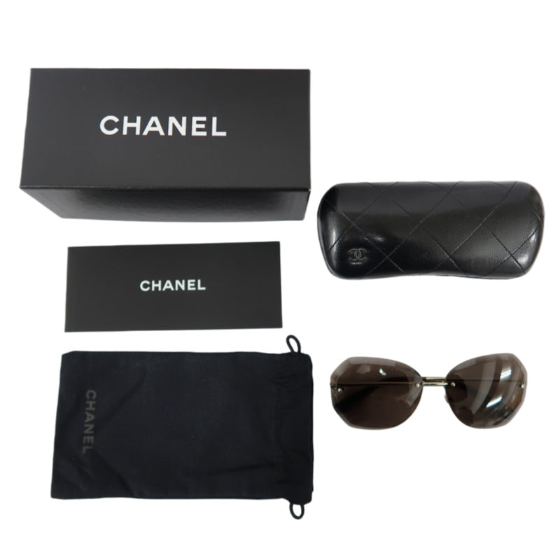 CHANEL Brown Resin Rimless Sunglasses With Gold Hardware, Comes With Original Outer Box, Inner Case And Two Dust Bags