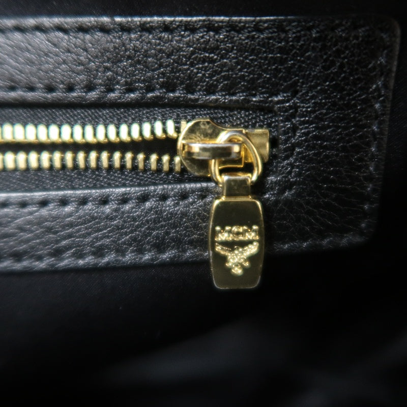MCM Monogram Studded Black White PVC Backpack With Gold Hardware