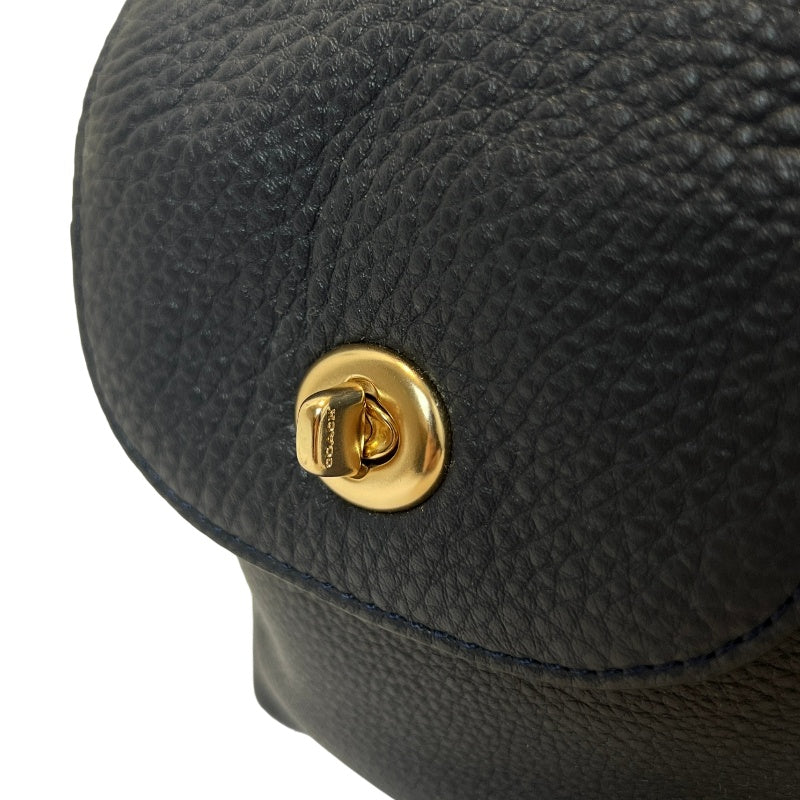 COACH Full Grain Pebbled Leather Backpack Black Calfskin Gold Hardware Front Twist Lock Pocket Spacious Casual Daily Commute Classic Design