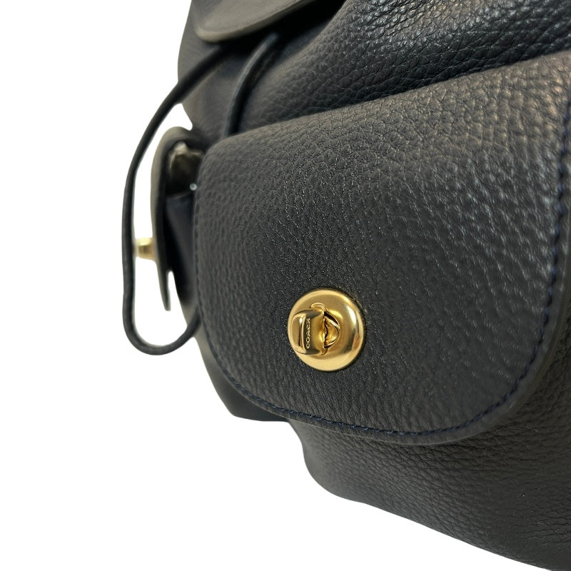 COACH Full Grain Pebbled Leather Backpack Black Calfskin Gold Hardware Front Twist Lock Pocket Spacious Casual Daily Commute Classic Design