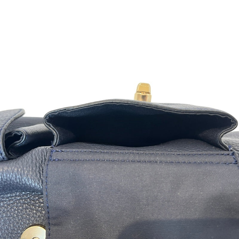COACH Full Grain Pebbled Leather Backpack Black Calfskin Gold Hardware Front Twist Lock Pocket Spacious Casual Daily Commute Classic Design