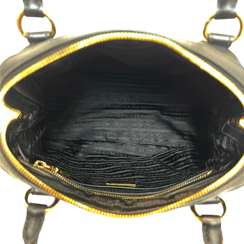 PRADA Tessuto Nylon Dome Handbag Black Nylon Saffiano Leather Trim Gold Hardware Spacious Work Bag with Detachable Shoulder Strap Classic Practical Design