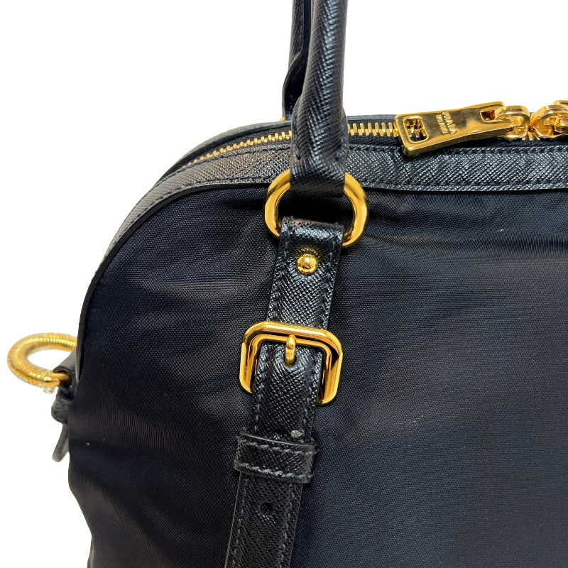 PRADA Tessuto Nylon Dome Handbag Black Nylon Saffiano Leather Trim Gold Hardware Spacious Work Bag with Detachable Shoulder Strap Classic Practical Design