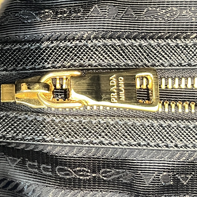 PRADA Tessuto Nylon Dome Handbag Black Nylon Saffiano Leather Trim Gold Hardware Spacious Work Bag with Detachable Shoulder Strap Classic Practical Design