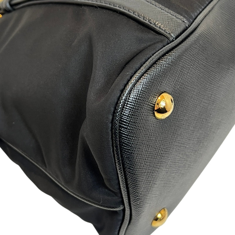 PRADA Tessuto Nylon Dome Handbag Black Nylon Saffiano Leather Trim Gold Hardware Spacious Work Bag with Detachable Shoulder Strap Classic Practical Design