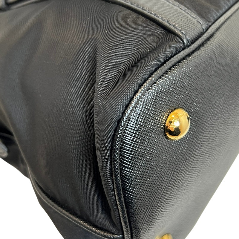 PRADA Tessuto Nylon Dome Handbag Black Nylon Saffiano Leather Trim Gold Hardware Spacious Work Bag with Detachable Shoulder Strap Classic Practical Design