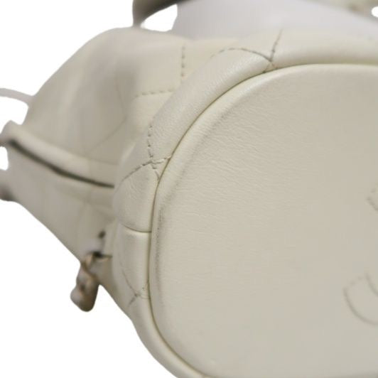 CHANEL Quilted Drawstring Backpack, Off-white Caviar Leather