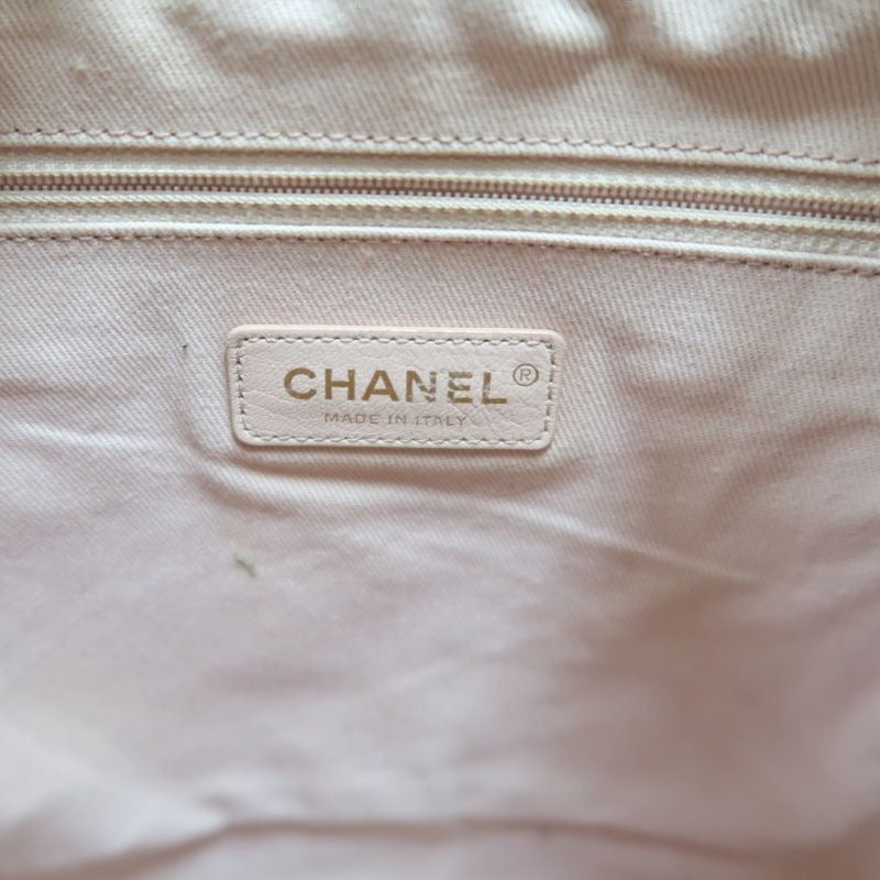 CHANEL Quilted Drawstring Backpack, Off-white Caviar Leather