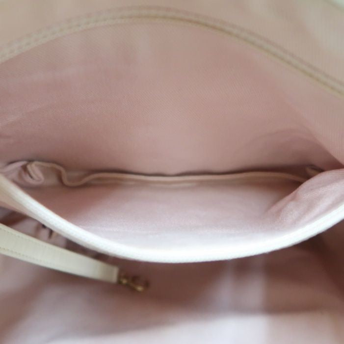 CHANEL Quilted Drawstring Backpack, Off-white Caviar Leather