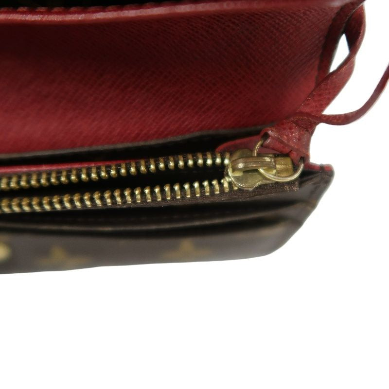 LOUIS VUITTON Monogram Brown Emilie Wallet with Red Button