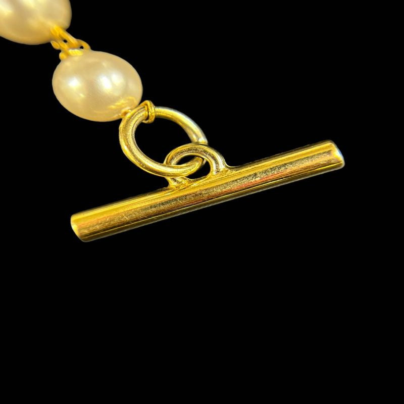Salvatore Ferragamo Pearl Long Necklace, Gold-tone Hardware. Salvatore Ferragamo White Alloy Pearl Necklace.