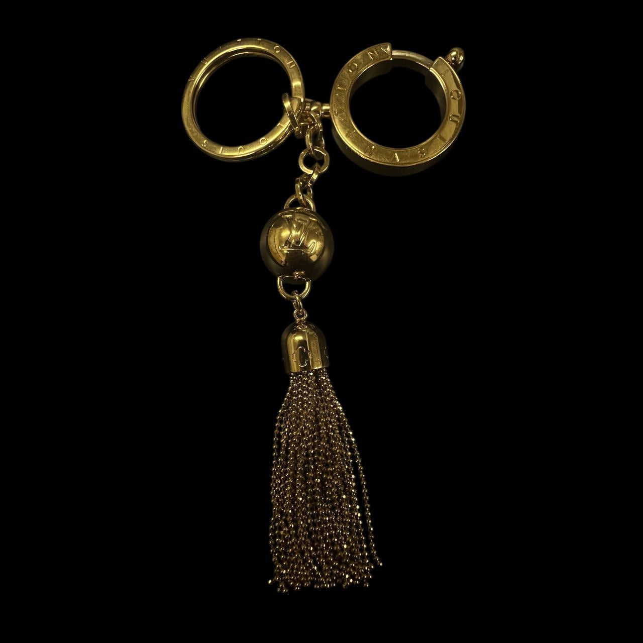 LOUIS VUITTON Porte-clés Wing, gold-tone hardware, tassel, key chain, LV key ring, alloy